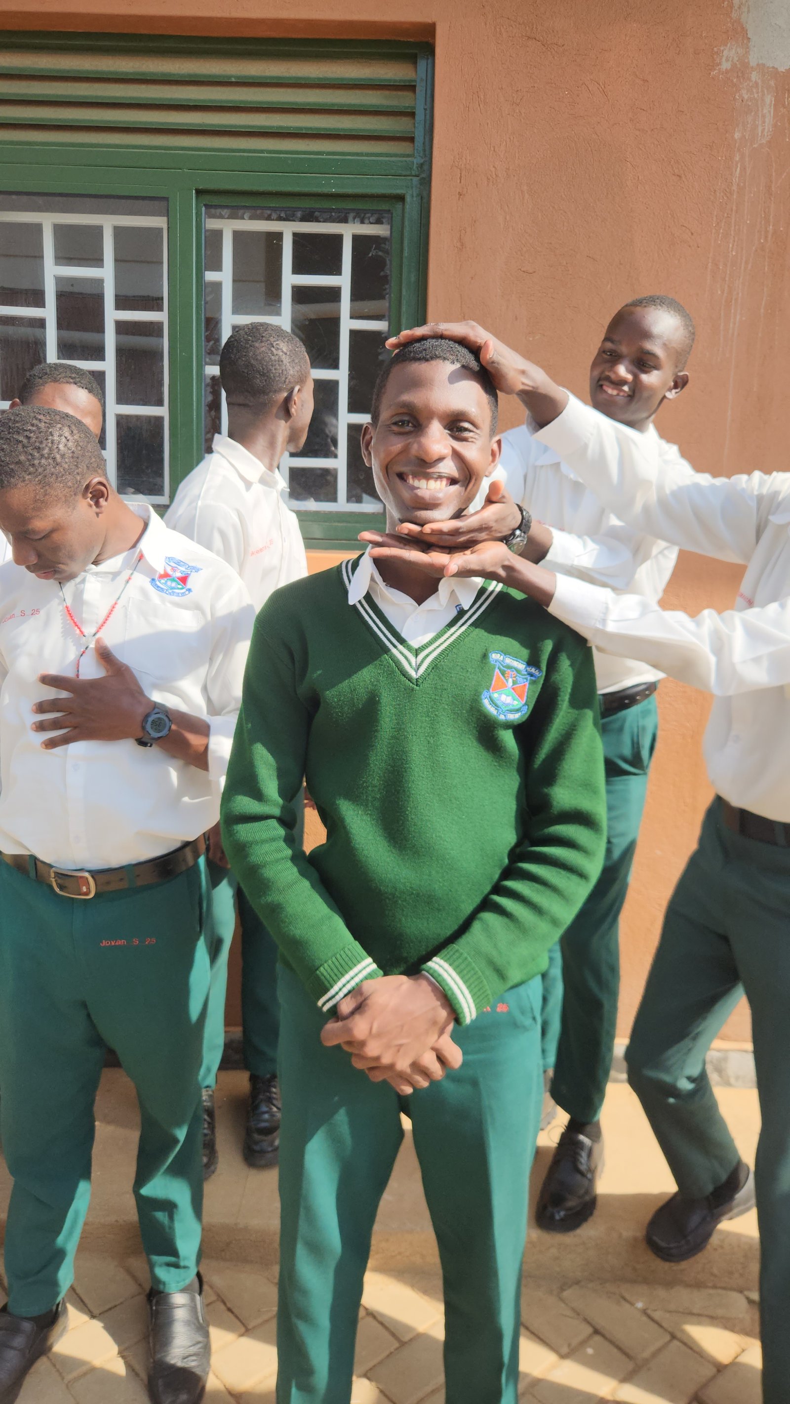Kira Secondary School students in green uniforms